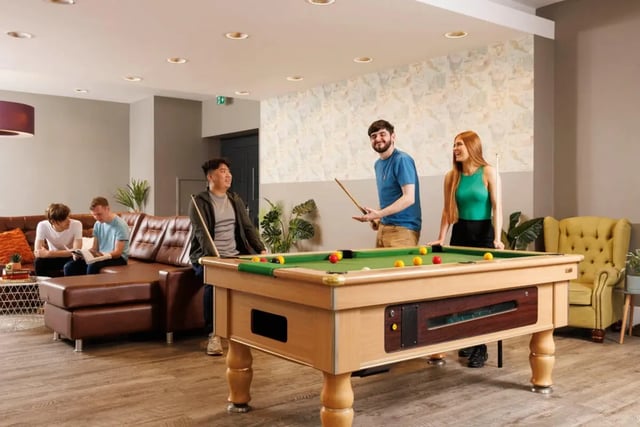 Pool table with people playing lounge living area at Quay Point Studios in Newcastle Upon Tyne Student Accommodation