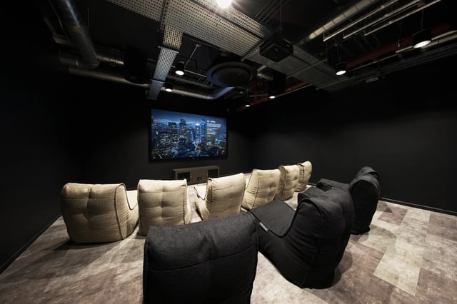 Beanbag chairs facing large screen movie room at White Rose View in Leeds Student Accommodation