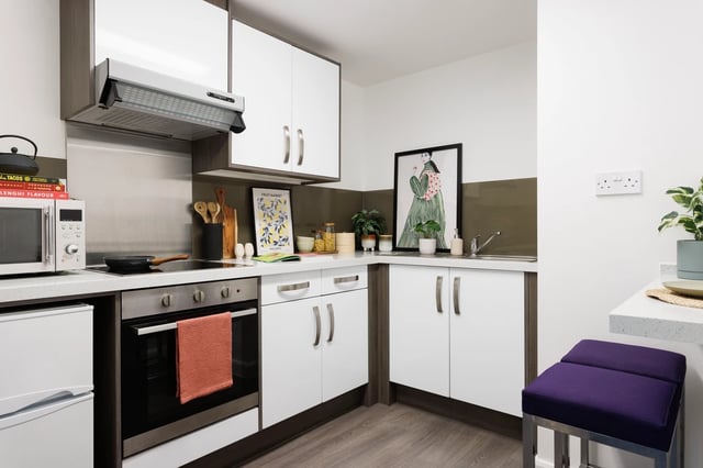 Microwave oven stove cabinets sink kitchen at Hepworth Lodge in Leeds Student Accommodation