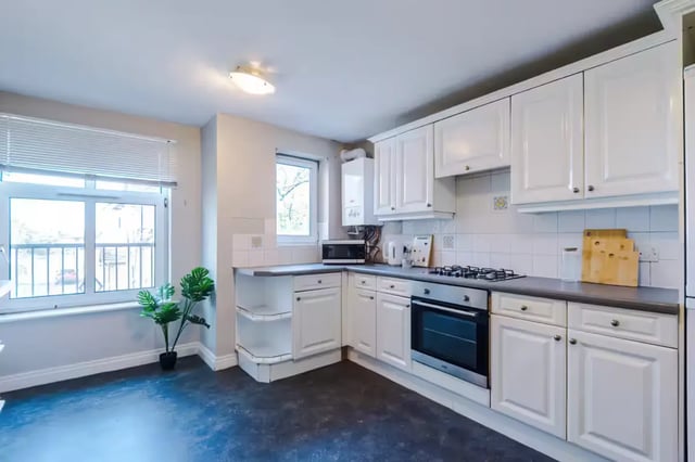 White cabinets oven and stove kitchen at Chancellor's Court in Manchester Student Accommodation