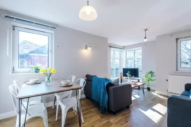 Dining table, chairs, sofa, TV, living room at Chancellor's Court in Manchester Student Accommodation