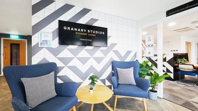 Two blue armchairs small table reception area exterior at Granary Studios in Chester Student Accommodation