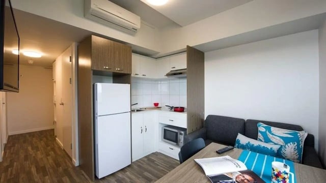 Kitchen living area with sofa and table Studio apartment at UniLodge Darwin in Darwin Student Accommodation
