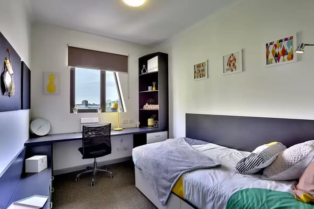 Bed desk chair and wall art bedroom at Scape Tribune in Brisbane Student Accommodation