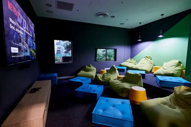 Beanbags blue ottomans television Netflix screen common area at Scape Tribune in Brisbane Student Accommodation