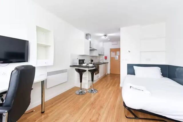 Desk television bed kitchen bar stools studio apartment at Brookland Road in Leicester Student Accommodation