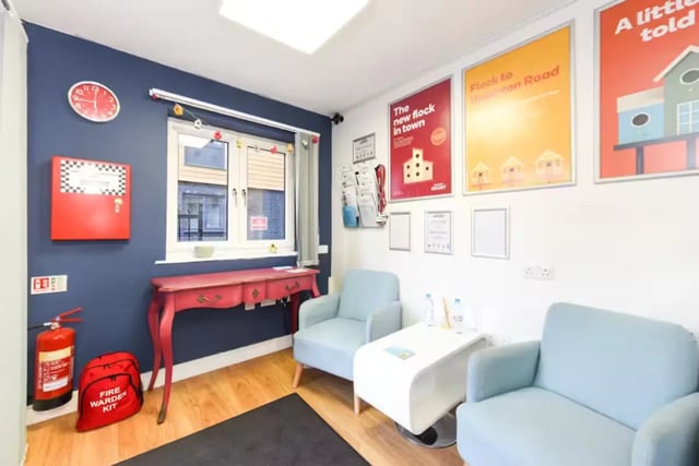 Fire extinguisher red desk two armchairs communal area at Brookland Road in Leicester Student Accommodation