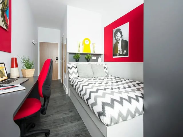 Bed desk chair laptop poster artwork bedroom at Yugo Arran House in Edinburgh Student Accommodation