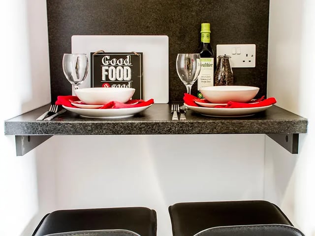 Tableware wine bottle and salt shaker kitchen area at Yugo Arran House in Edinburgh Student Accommodation