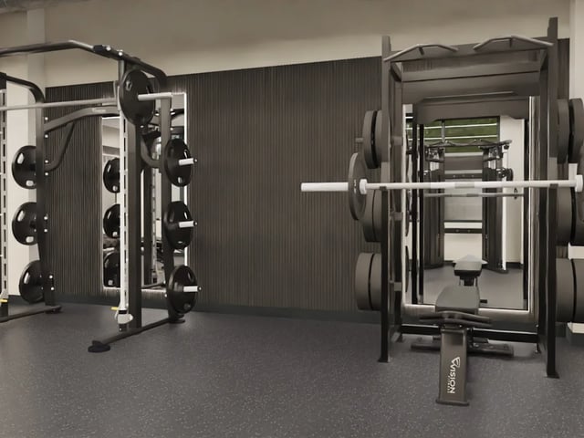 Weight racks and bench in gym gym at The Tannery Leicester in Leicester Student Accommodation