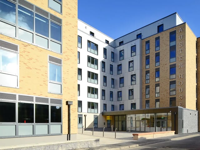 Modern student accommodation building with glass entrance exterior at Yugo Austen House in Southampton Student Accommodation