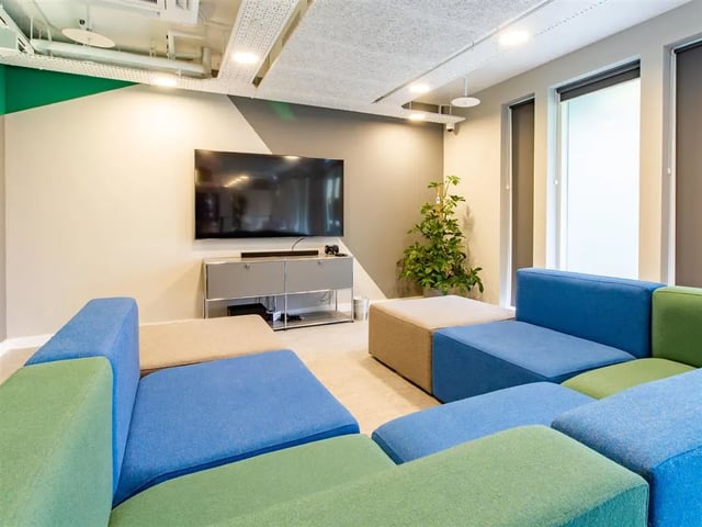 Modular seating and television in a common area at Benedict's Gate in Norwich Student Accommodation