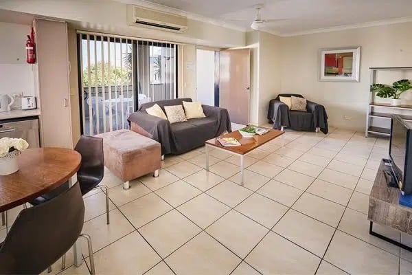 Sofas ottoman coffee table chairs living room at Genesis 1 in Brisbane Student Accommodation