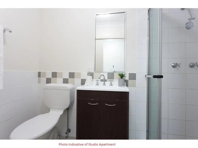 Toilet sink mirror and shower stall bathroom at Altitude Taringa in Brisbane Student Accommodation