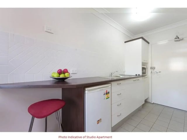Bar stool fridge fruit bowl sink kitchen at Altitude Taringa in Brisbane Student Accommodation