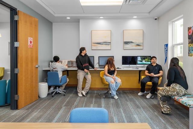 Students studying at computers in lounge area at The Glen in San Bernardino Student Accommodation