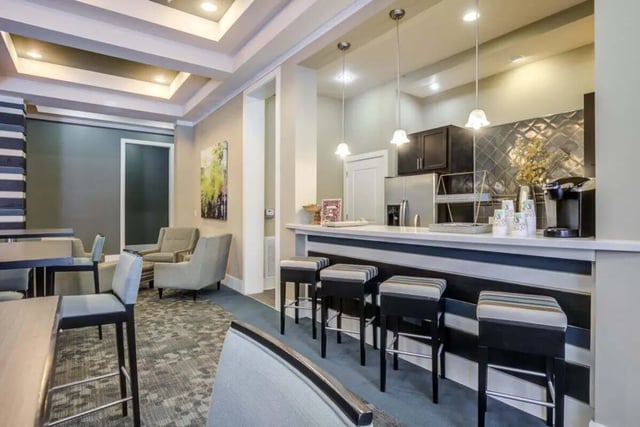 Bar stools and counter with coffee maker kitchen at The Union Charlotte in Charlotte Student Accommodation