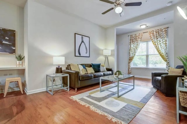 Brown couch coffee table rug living room at The Union Charlotte in Charlotte Student Accommodation