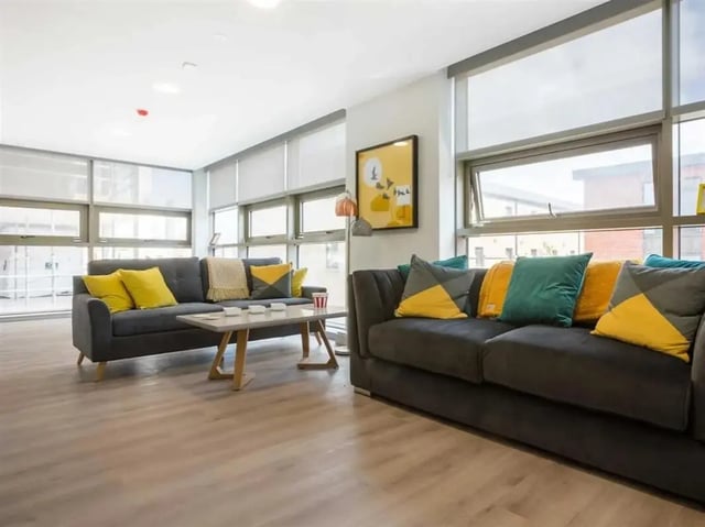 Two sofas with colorful cushions and coffee table living room at Brickworks in Dublin Student Accommodation