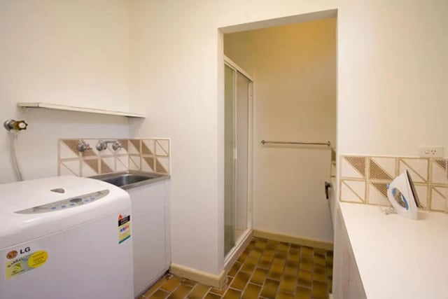 Washer sink iron and shower laundry room at Greenwood House in Melbourne Student Accommodation