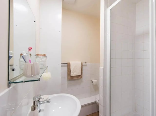 Sink toiletries shower and toilet bathroom at Optima in Loughborough Student Accommodation