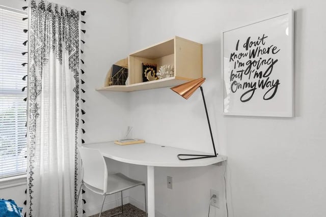 Desk chair shelf lamp picture framed study area at Cabana Beach Gainesville in Gainesville Student Accommodation