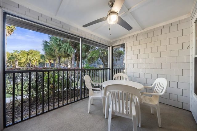 Table chairs on screened porch patio balcony at Cabana Beach Gainesville in Gainesville Student Accommodation