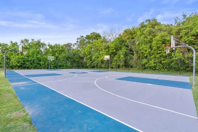 Basketball court with multiple hoops and markings playing area at Cabana Beach Gainesville in Gainesville Student Accommodation