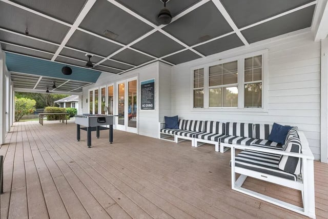 Foosball table striped seating covered patio exterior at Cabana Beach Gainesville in Gainesville Student Accommodation