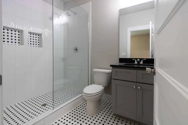 Toilet vanity sink shower with glass enclosure bathroom at Burt, Marcom, Collegeview & Reavis in Raleigh Student Accommodation