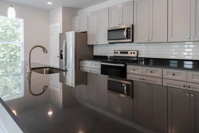 Stainless steel refrigerator stove microwave sink kitchen at Burt, Marcom, Collegeview & Reavis in Raleigh Student Accommodation