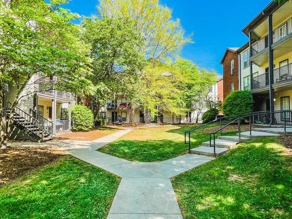 Apartment buildings green lawn walkways exterior at Alight Blacksburg in Blacksburg Student Accommodation