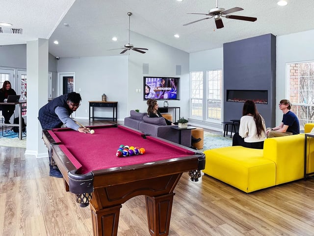 Pool table lounge area with fireplace television living room at Alight Blacksburg in Blacksburg Student Accommodation