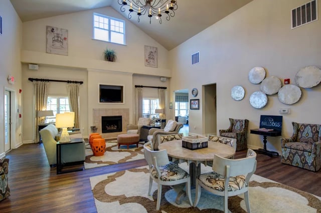 Living room with fireplace dining table and seating. at The Verge at Asheville in Asheville Student Accommodation