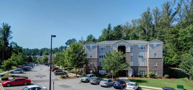 Apartment building with parking lot exterior at The Verge at Asheville in Asheville Student Accommodation