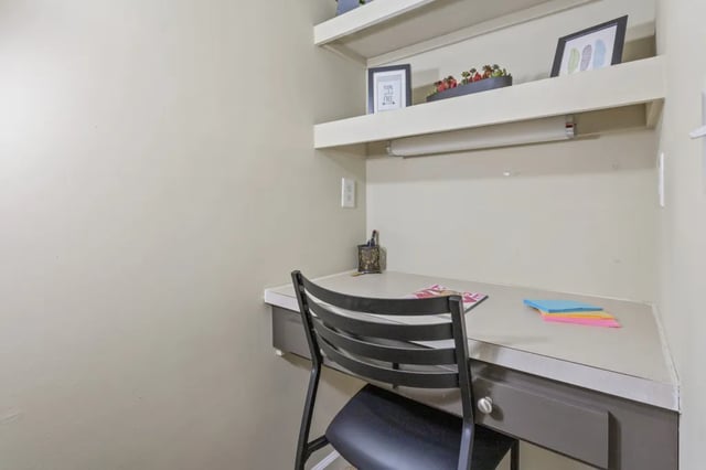 Desk with chair and shelves study area at West Quad Greensboro in Greensboro Student Accommodation