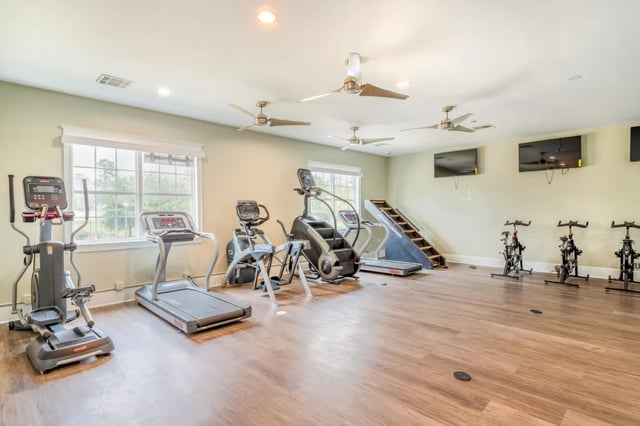 Treadmills elliptical stair climber spin bikes gym at Grove at Huntsville in Huntsville Student Accommodation