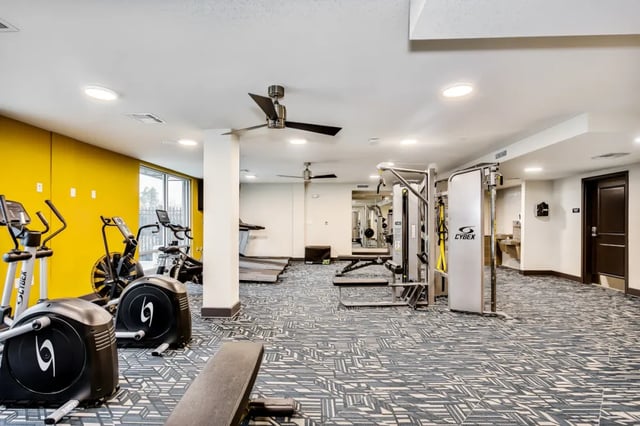 Elliptical machines treadmills weight machines fitness room at Altitude at Wichita in Wichita Student Accommodation