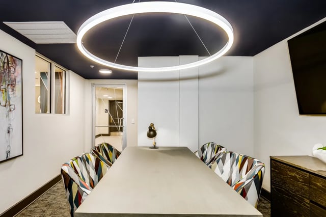 Modern table with chairs artwork and lamp meeting room at Altitude at Wichita in Wichita Student Accommodation