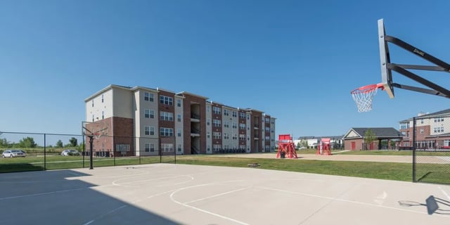 Basketball court with apartment building exterior at The Reserve Mount Pleasant in Mount Pleasant Student Accommodation