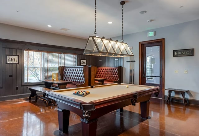 Pool table tufted booths and billiard cues playing area at The Reserve Mount Pleasant in Mount Pleasant Student Accommodation