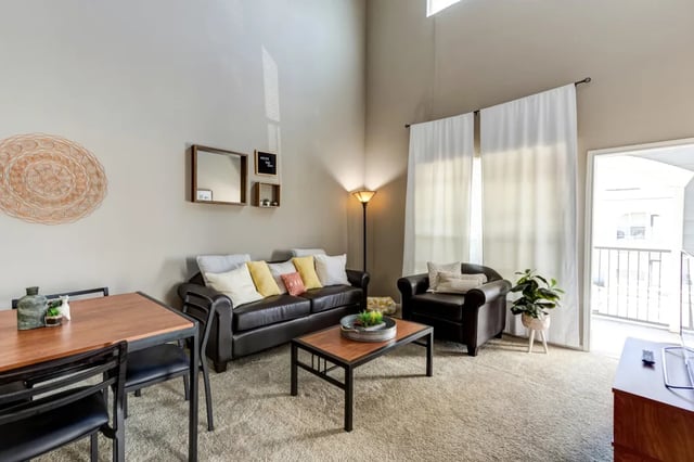 Sofa chairs coffee table dining set living room at Cambridge @ Southern - The Palms in Statesboro Student Accommodation