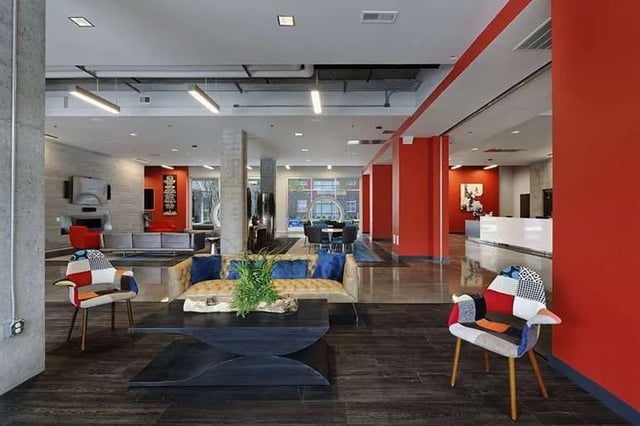 Sofa chairs coffee table and desk living room at LUX on Capitol in Indianapolis Student Accommodation