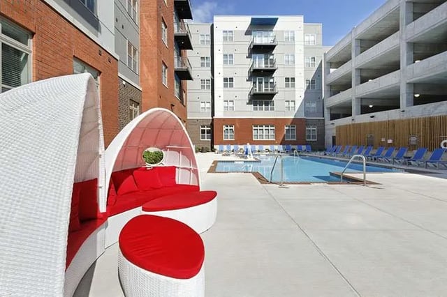 White cabana with red cushions pool exterior at LUX on Capitol in Indianapolis Student Accommodation