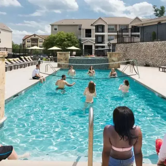 People playing volleyball in a pool exterior at The Quarters at Columbia in Columbia Student Accommodation