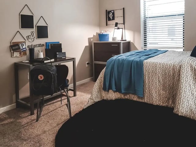Desk backpack bedding and dresser bedroom at Ion Baton Rouge in Baton Rouge Student Accommodation