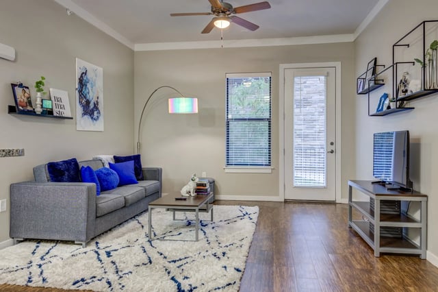 Sofa coffee table rug and TV living room at Ion Baton Rouge in Baton Rouge Student Accommodation