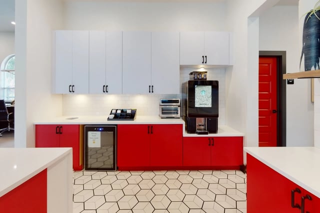 Coffee machine toaster mini fridge red cabinets kitchen at The Quarters at Oxford in Oxford Student Accommodation