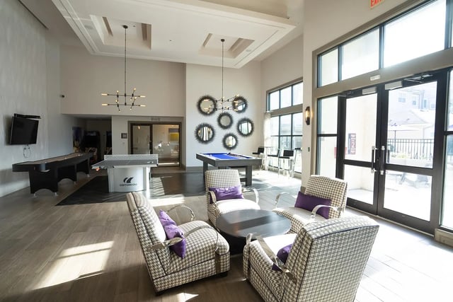 Shuffleboard table ping pong and pool living room at The Legacy Baton Rouge in Baton Rouge Student Accommodation