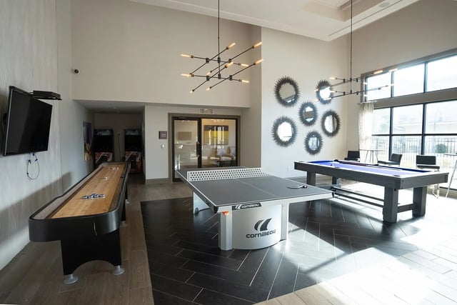 Shuffleboard table ping pong and pool tables gaming area at The Legacy Baton Rouge in Baton Rouge Student Accommodation